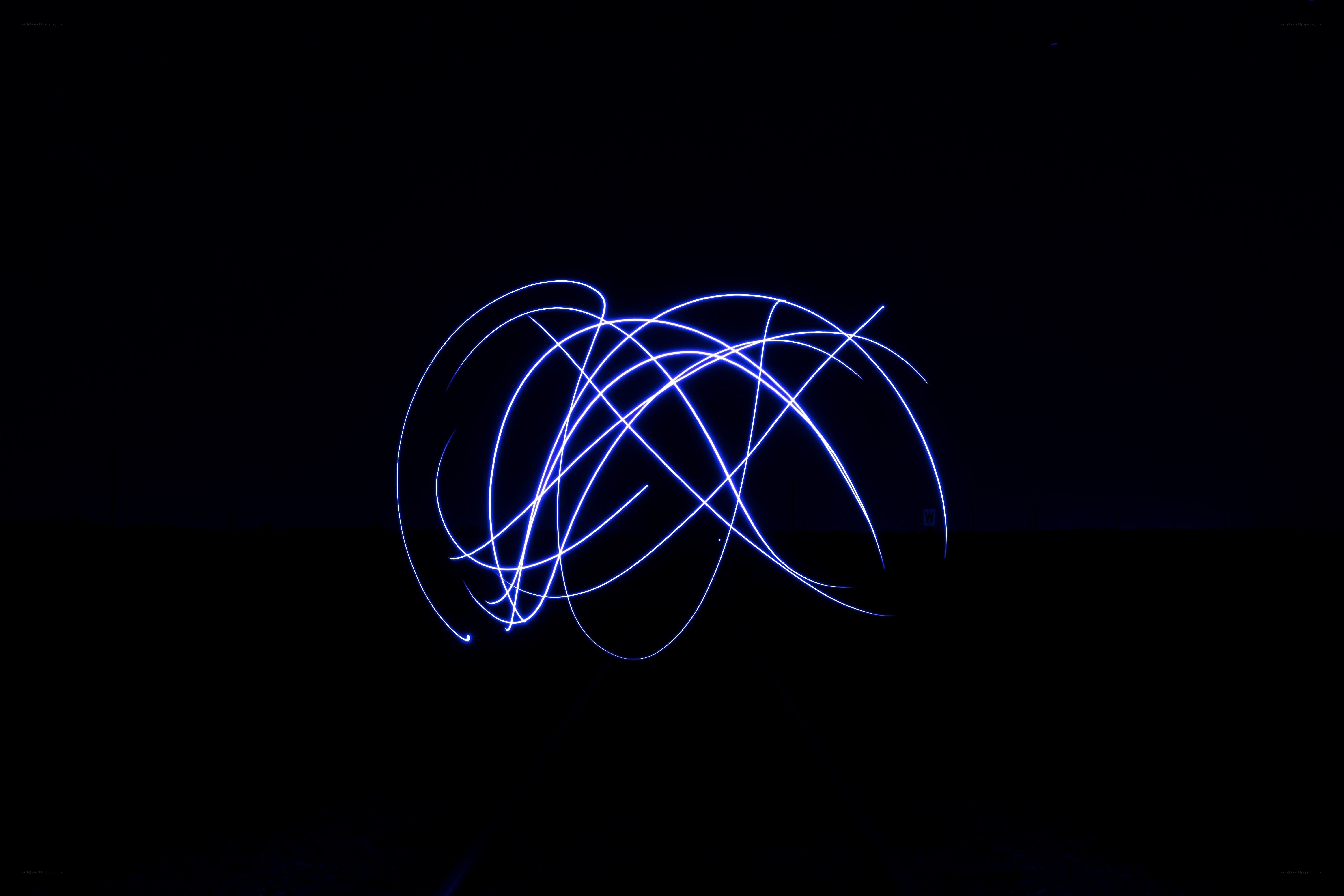 Blue light trails in darkness