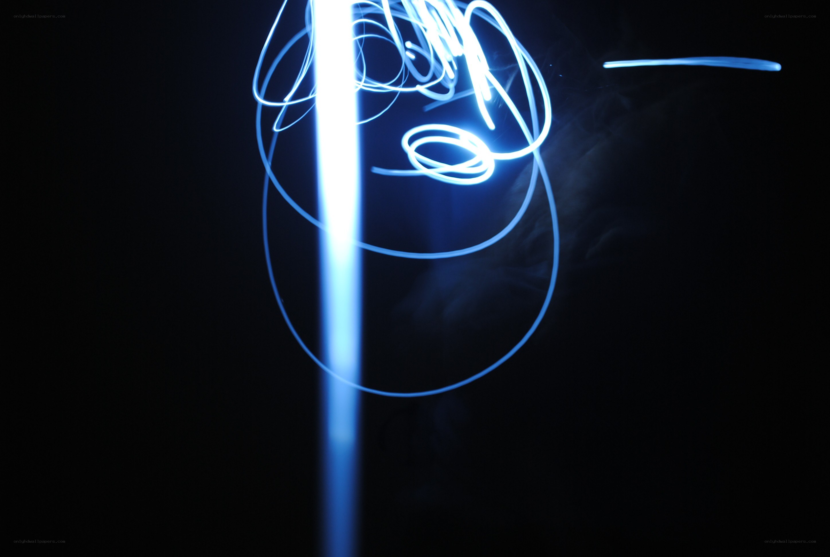 blue light trails on black
