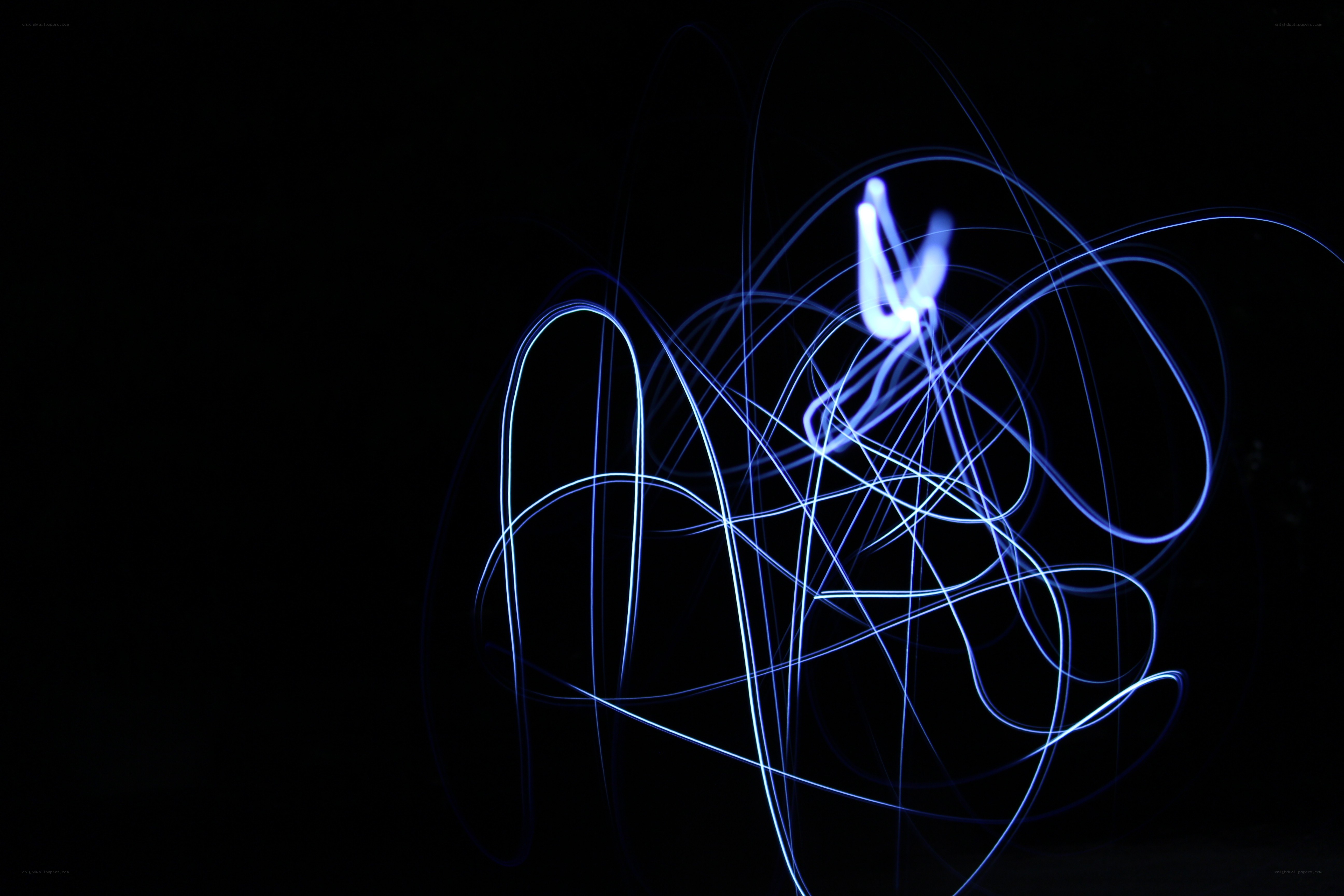 blue light trails on black