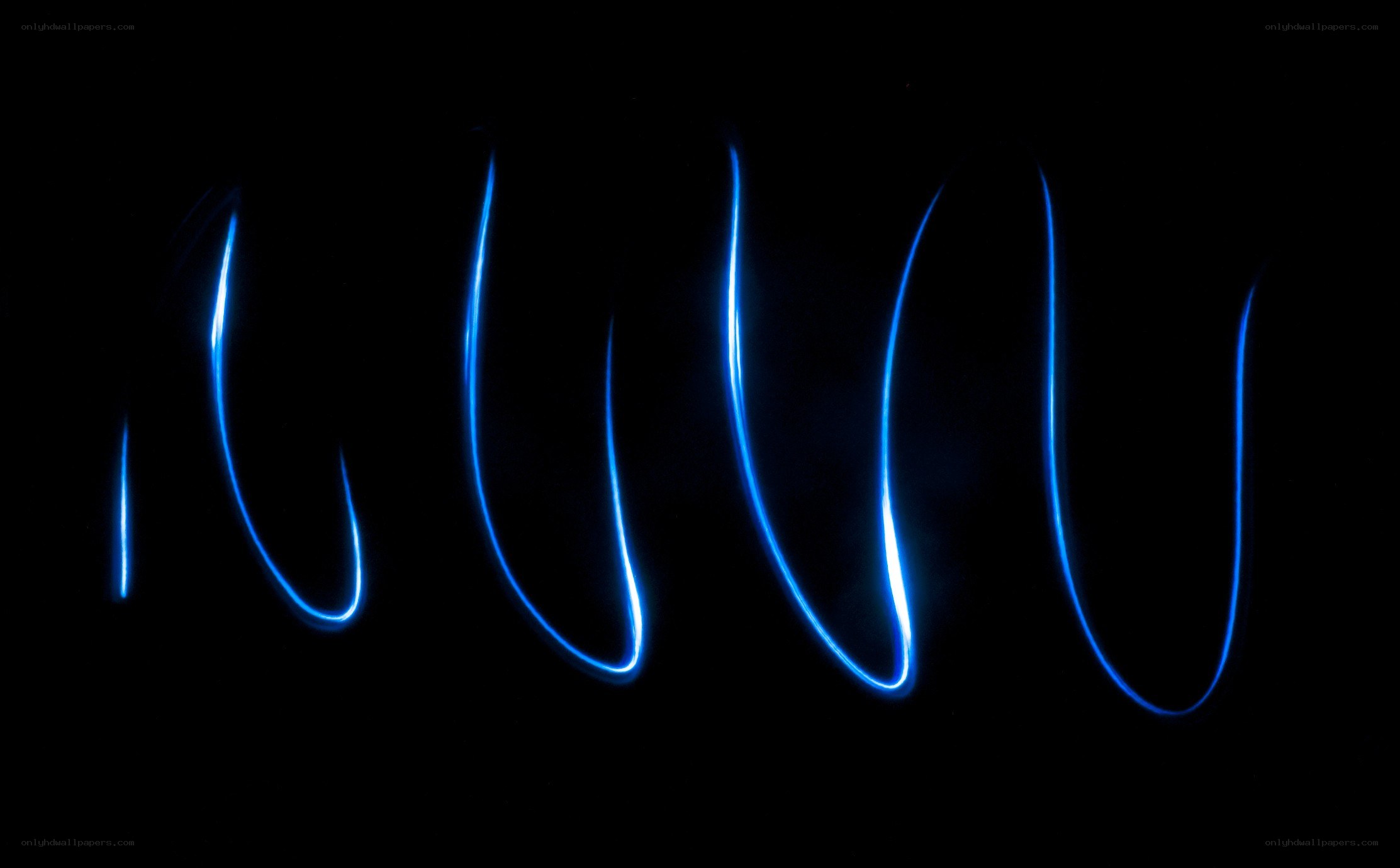 blue light trails on black