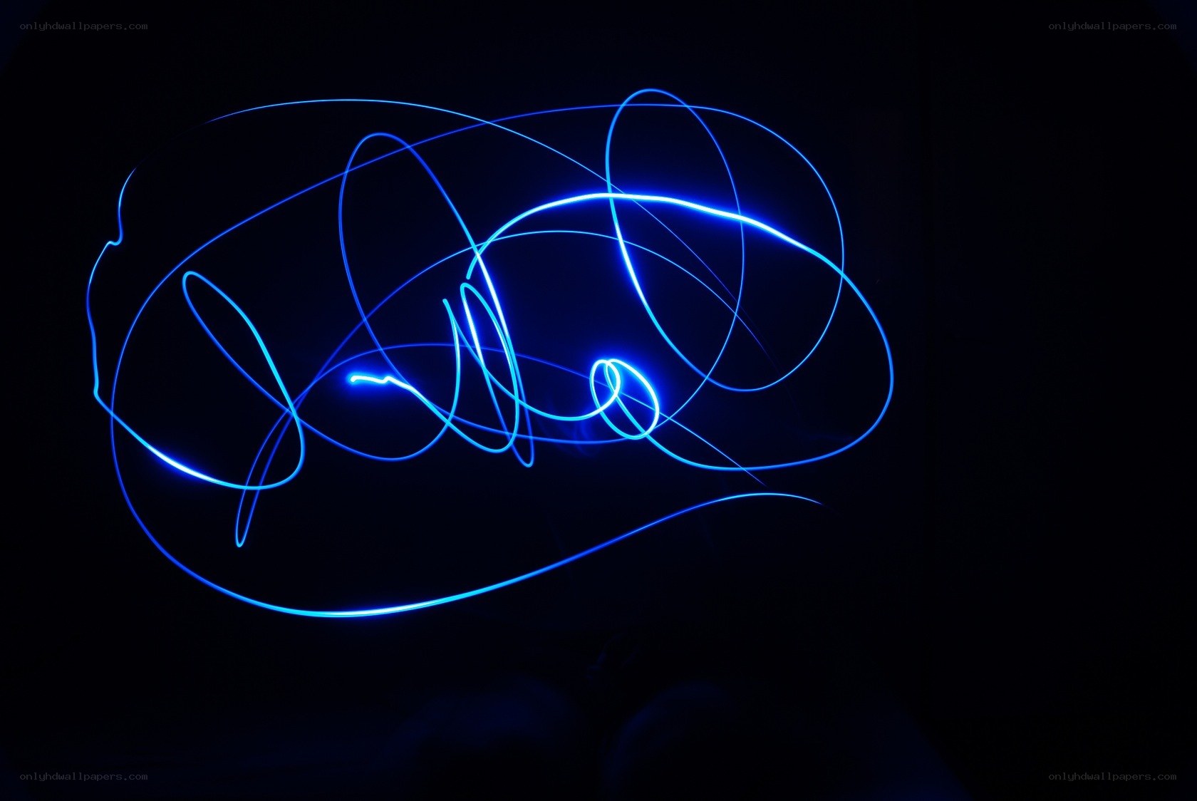 Blue light trails on black