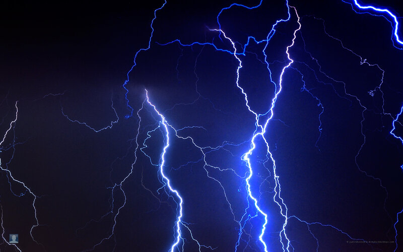 Blue lightning storm at night