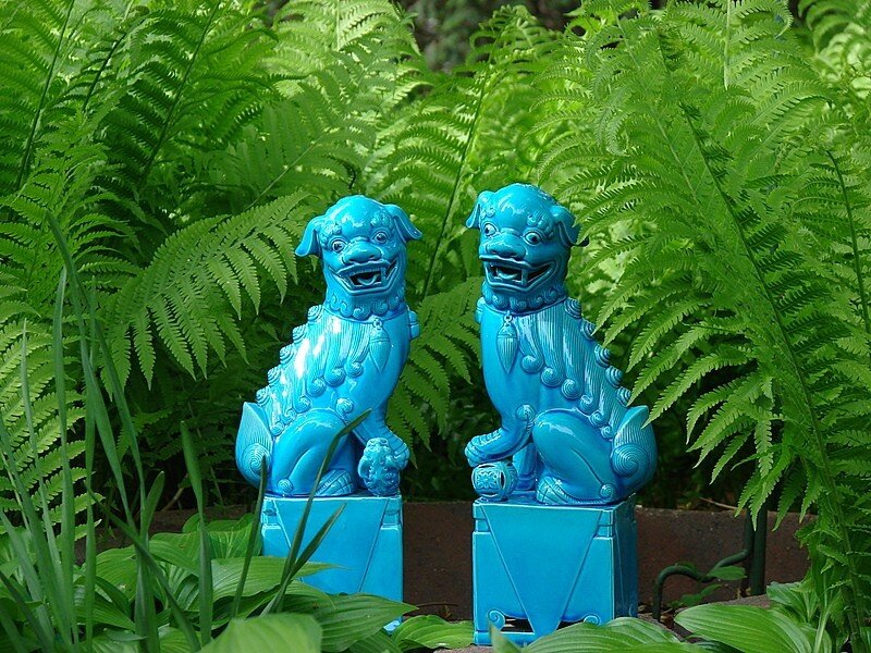 Blue lion statues in garden