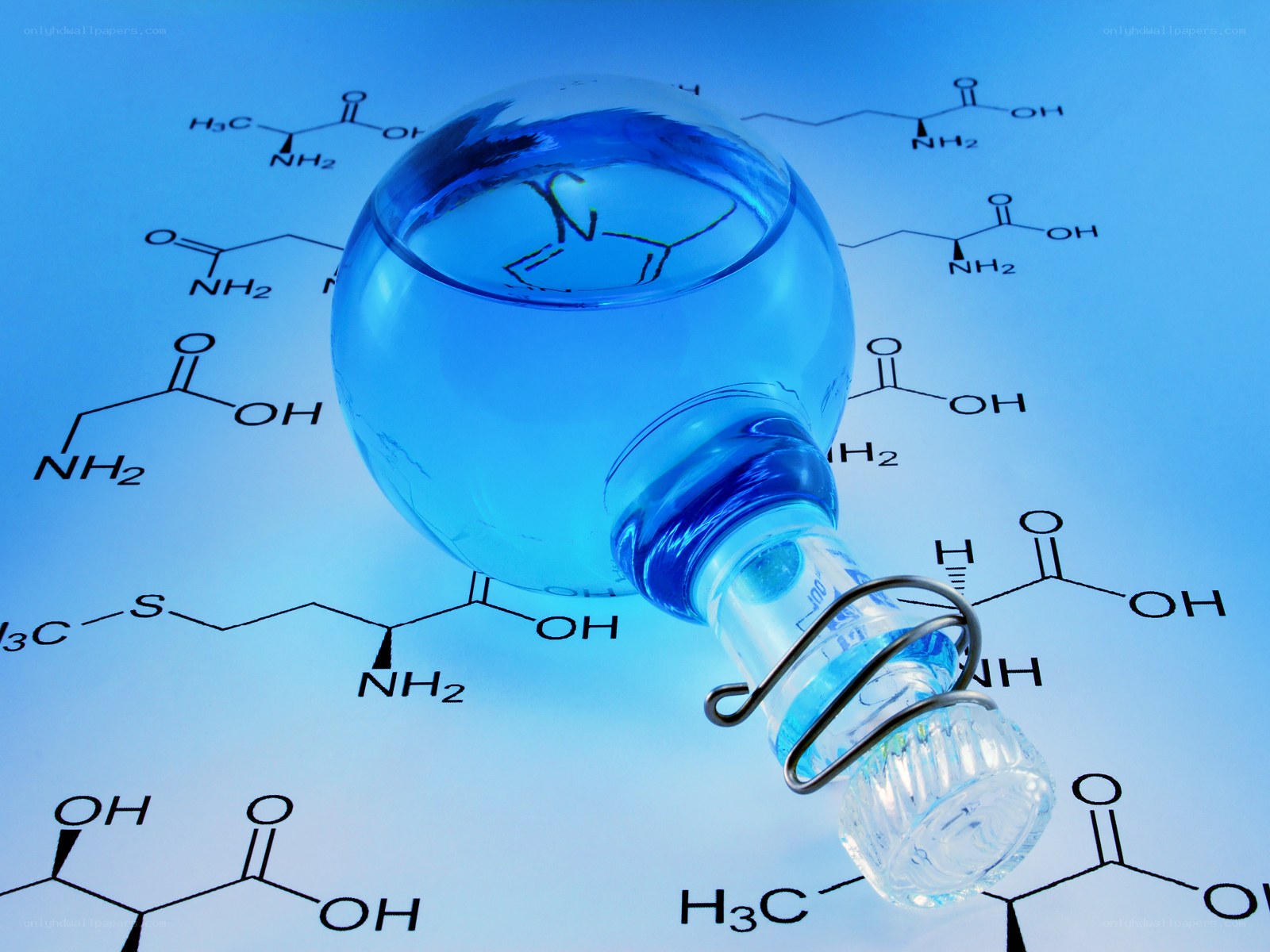 Blue liquid in flask with chemical formulas