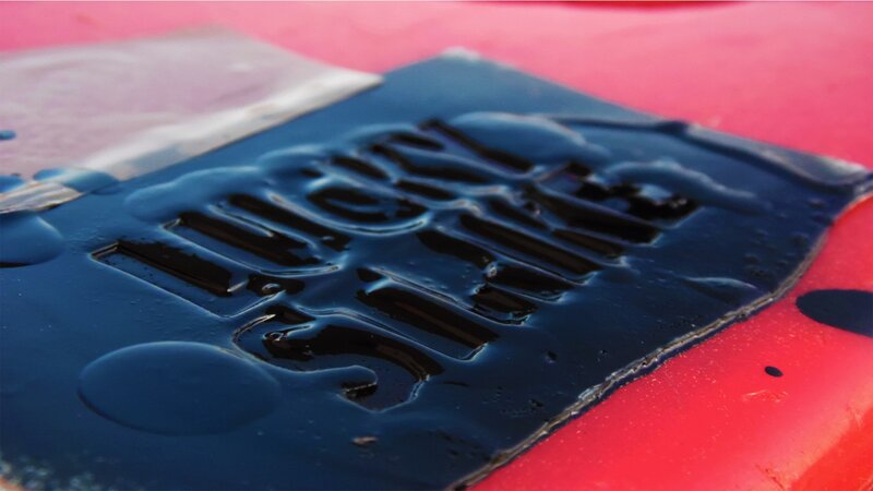 Blue Liquid on Red Surface