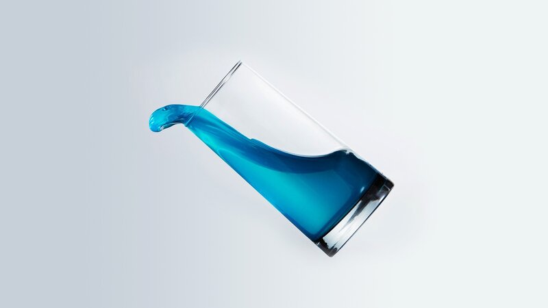 Blue Liquid Pouring from Glass — Calm