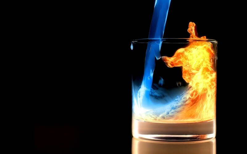 Blue Liquid Pouring into Glass — Black, Dramatic