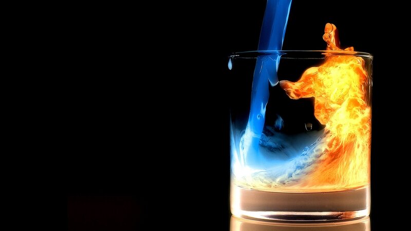 Blue Liquid Pouring into Glass — Fire