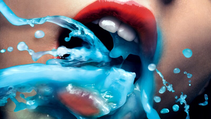 blue liquid splashing from mouth