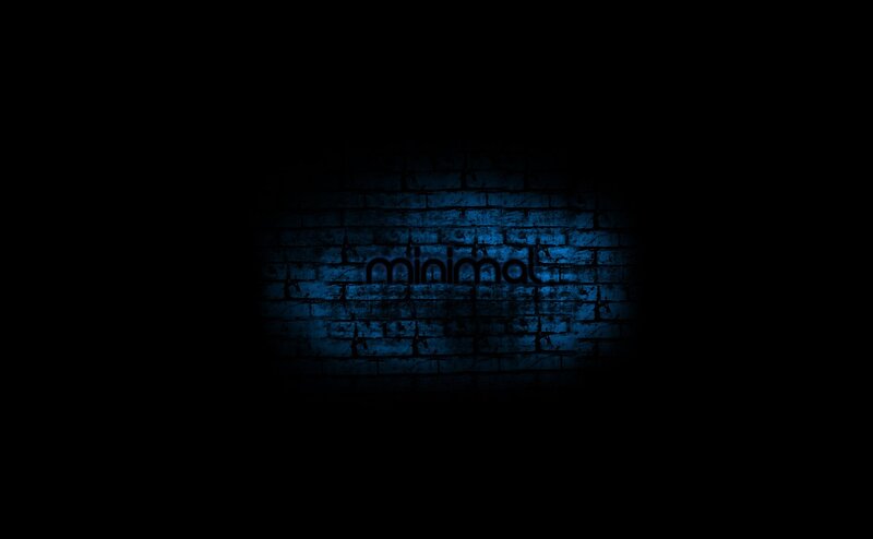 blue-lit brick wall with text