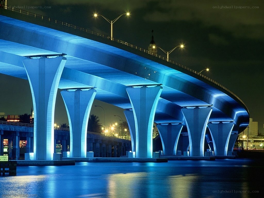 Blue-lit bridge at night
