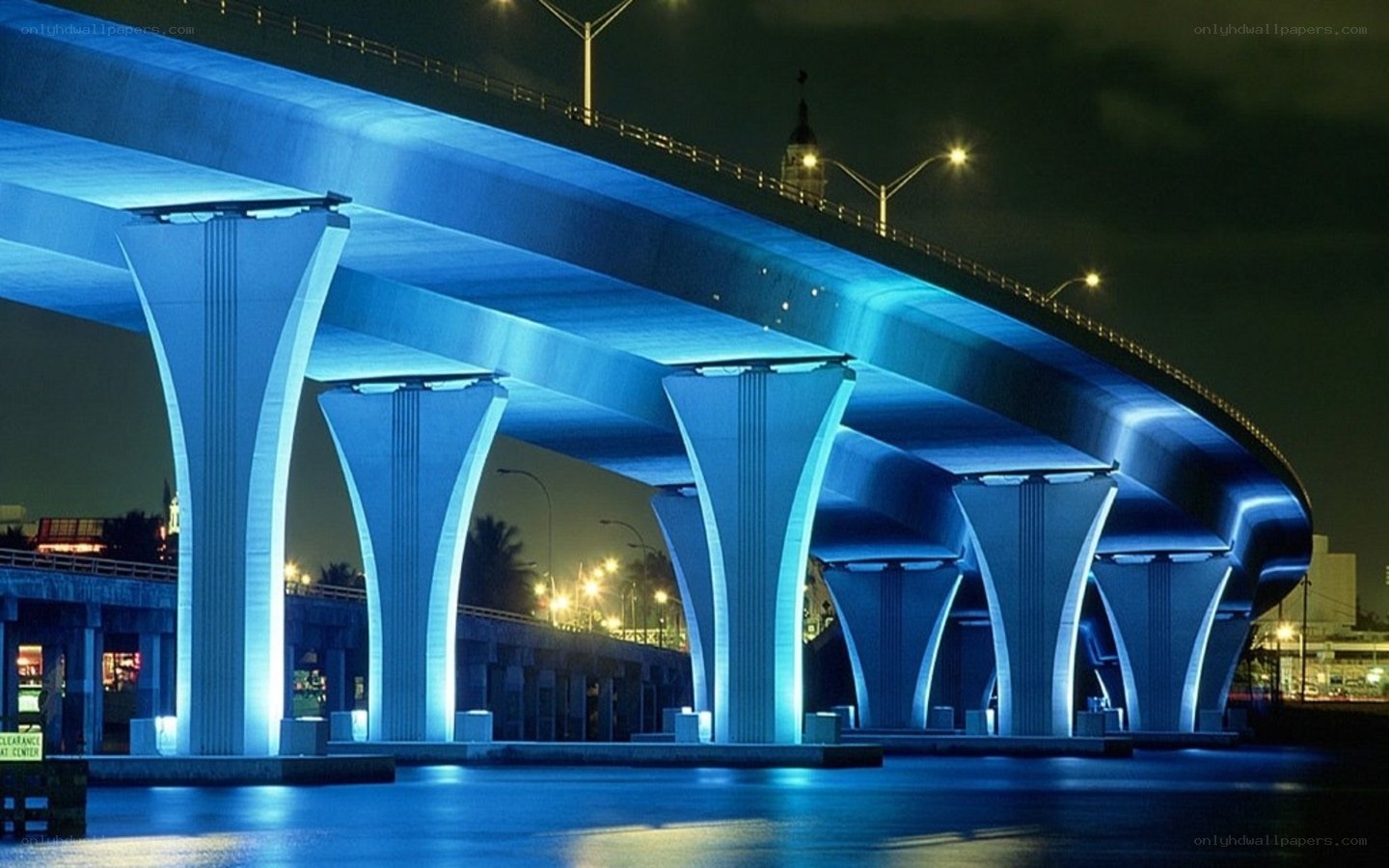 Blue-lit bridge at night