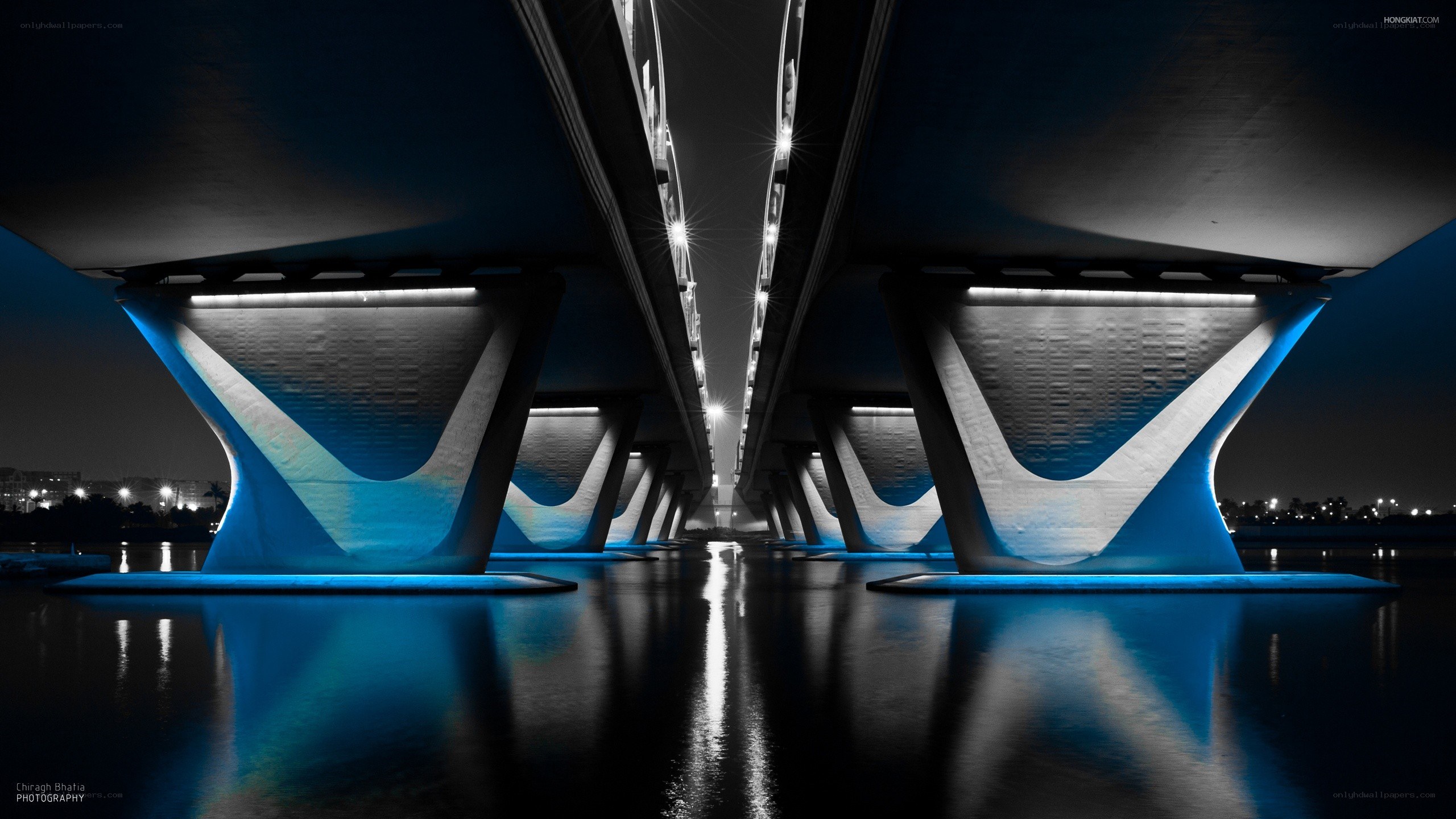 Blue-lit bridge at night