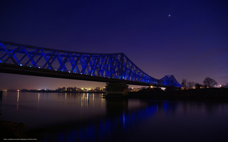 Blue-lit bridge at night