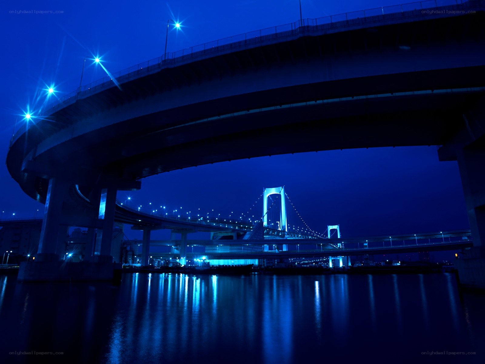 Blue-lit bridges at night