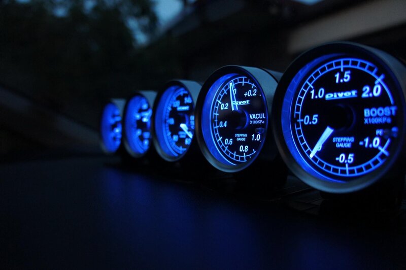 blue-lit car gauges