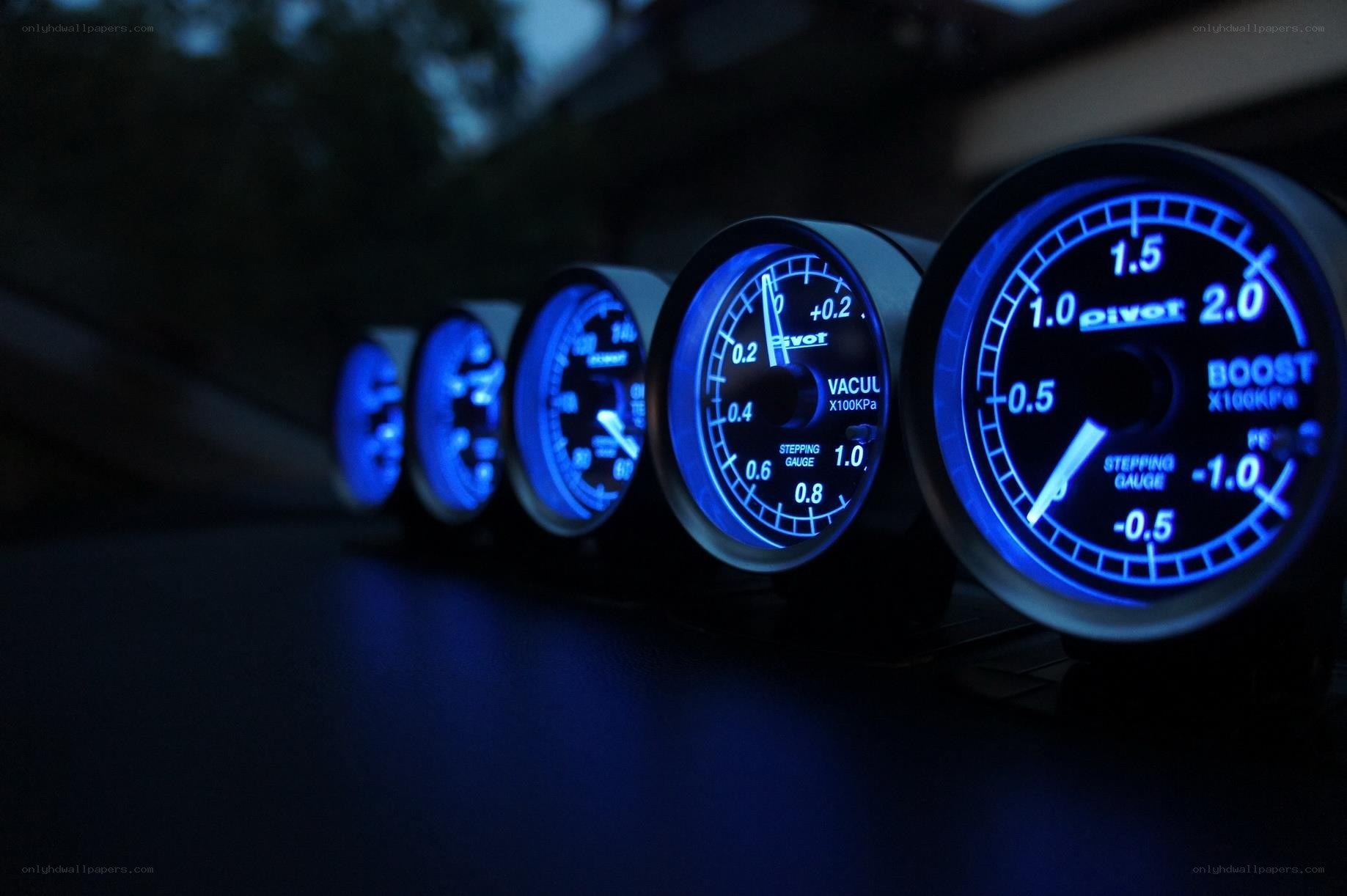 blue-lit car gauges