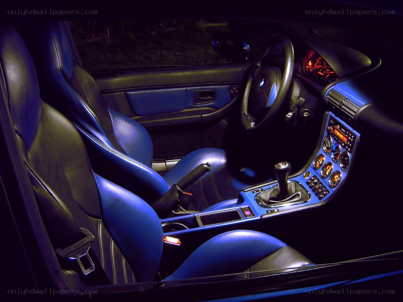 blue-lit car interior at night