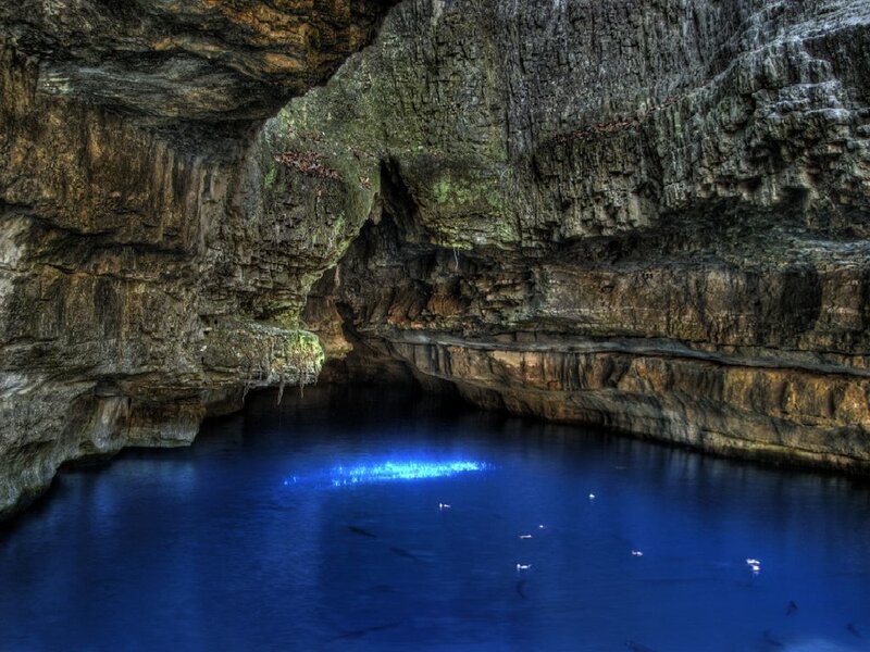 Blue-lit cave pool