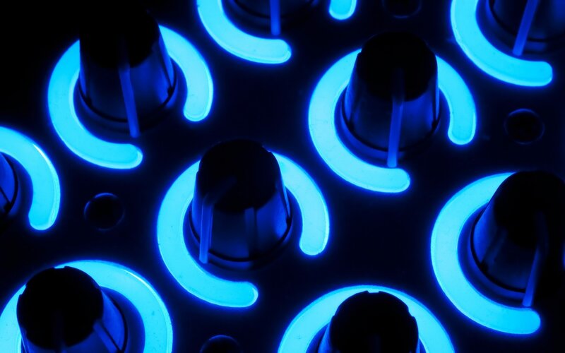 blue-lit control knobs
