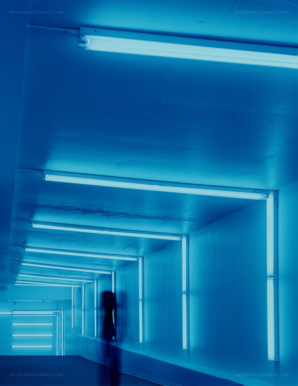 Blue-lit corridor with neon lights