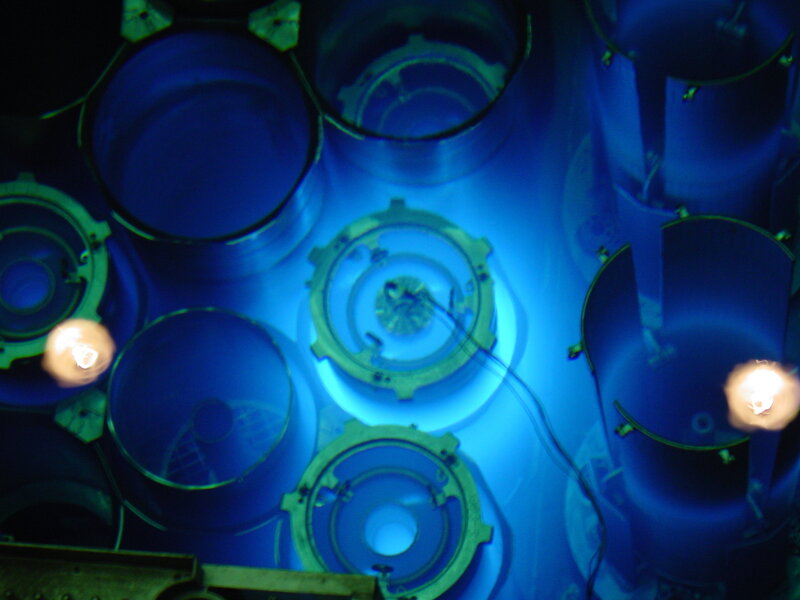 blue-lit cylindrical components