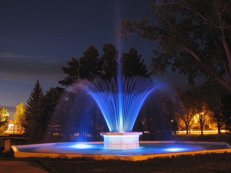 blue-lit fountain at night