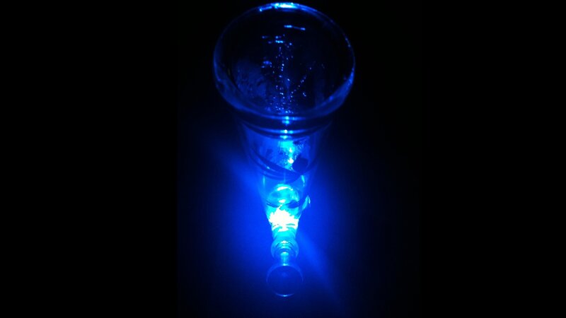 blue-lit glass object