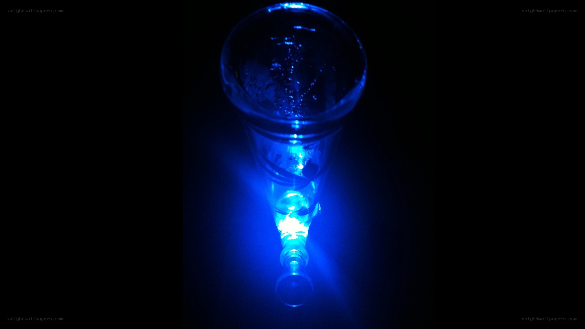 blue-lit glass object