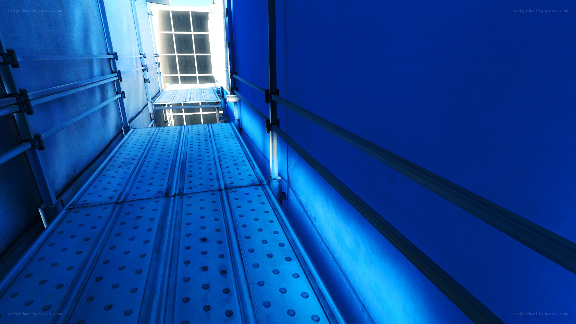 blue-lit industrial walkway