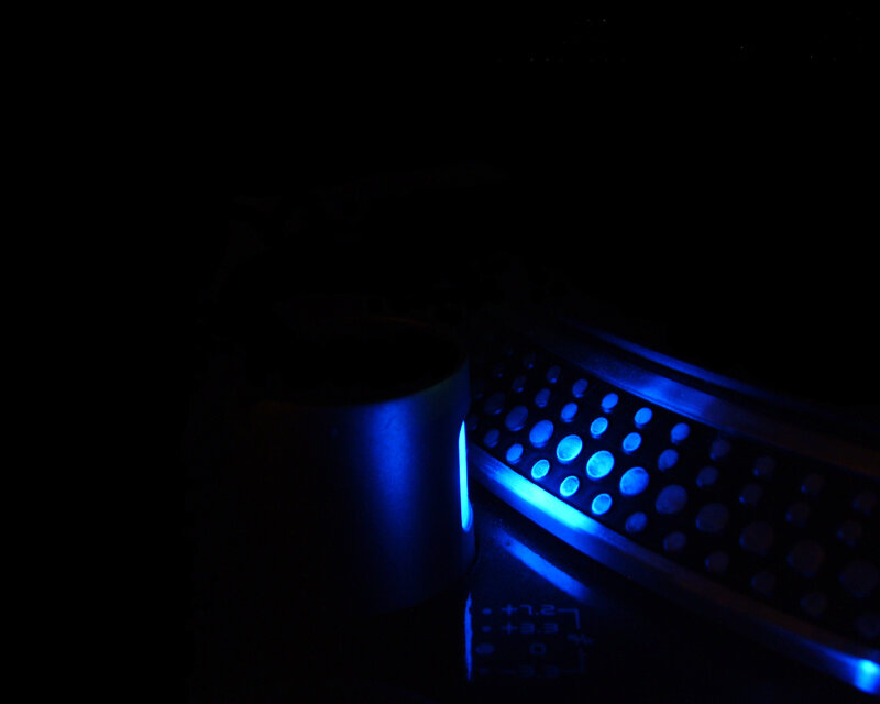 blue-lit keyboard in dark room