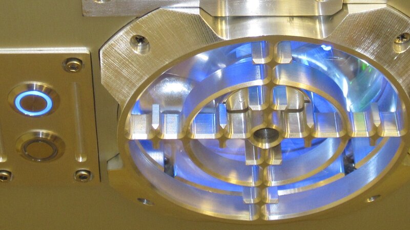 blue-lit mechanical device