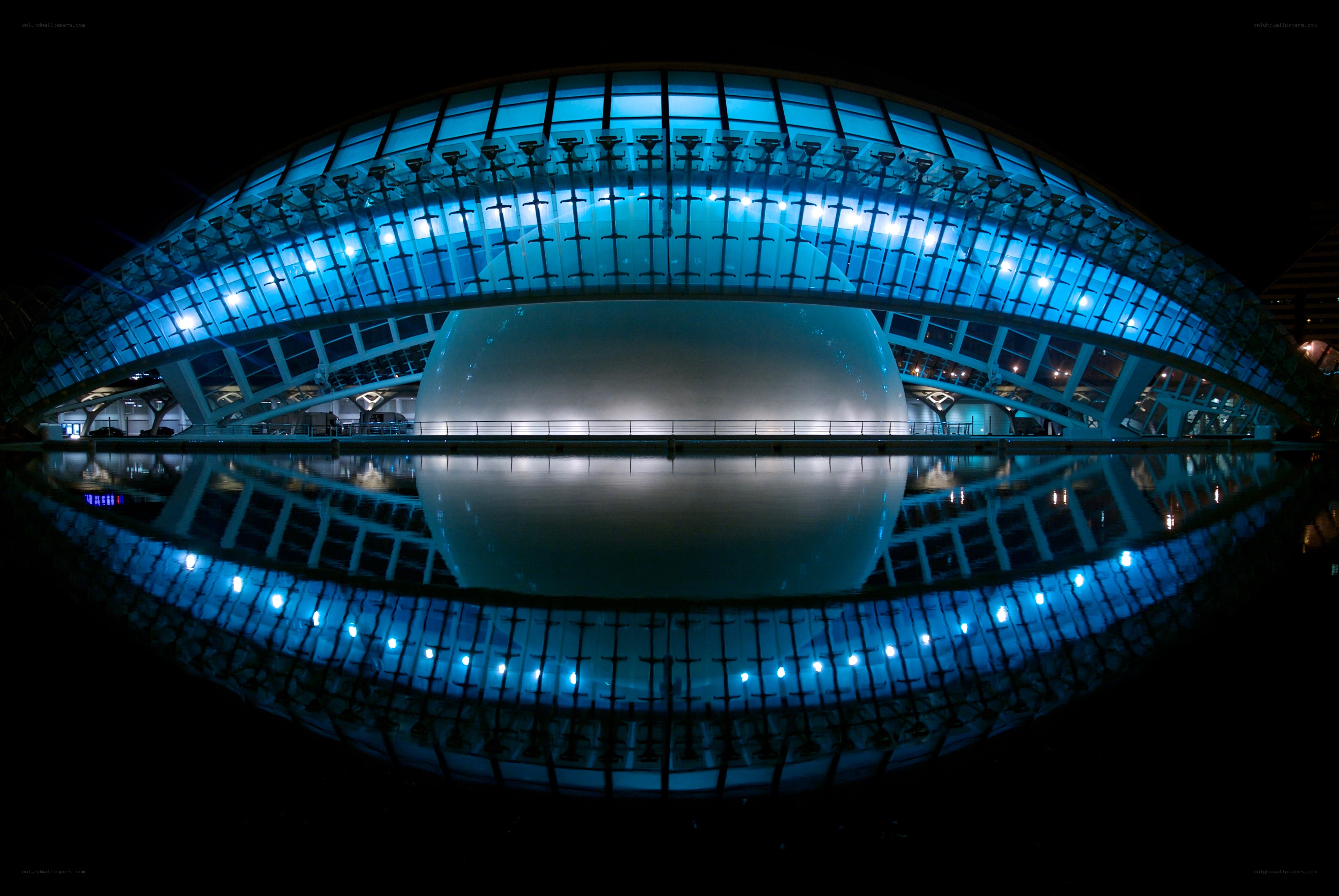 Blue-lit modern architecture at night