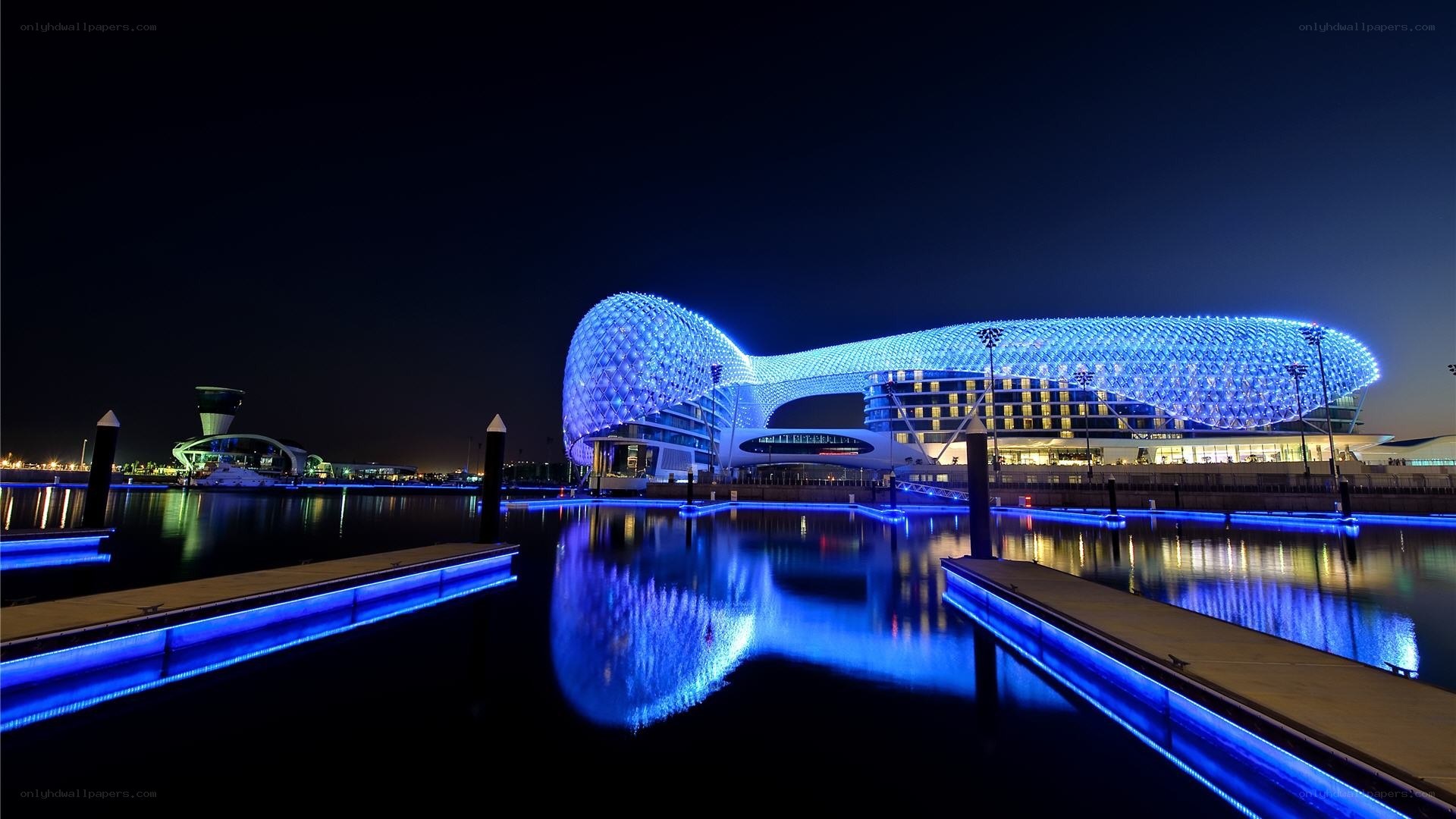 Blue-lit modern building at night