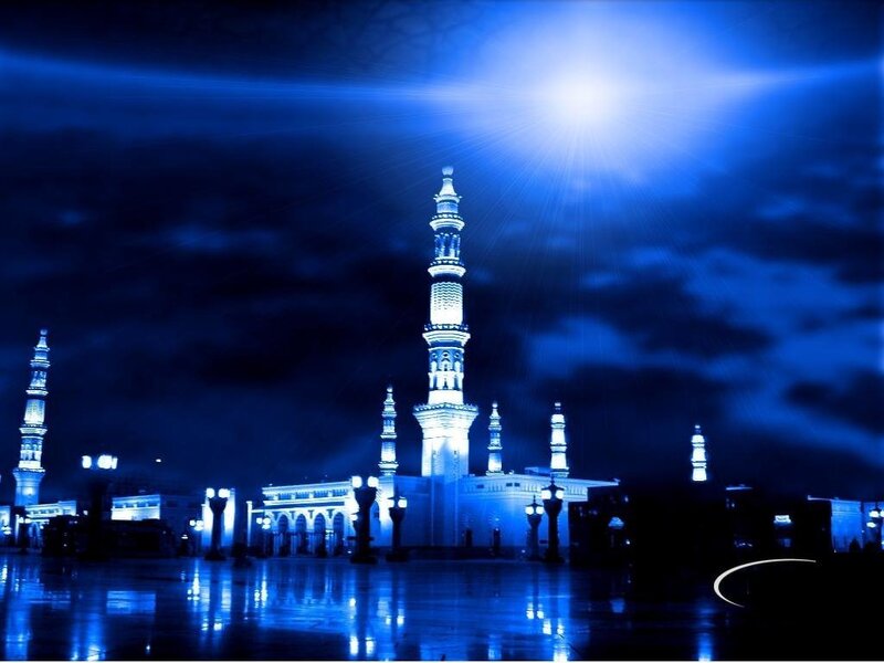Blue-lit mosque at night