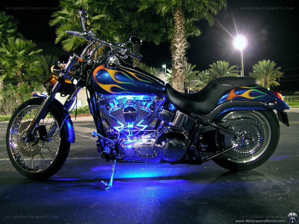 Blue-lit motorcycle at night