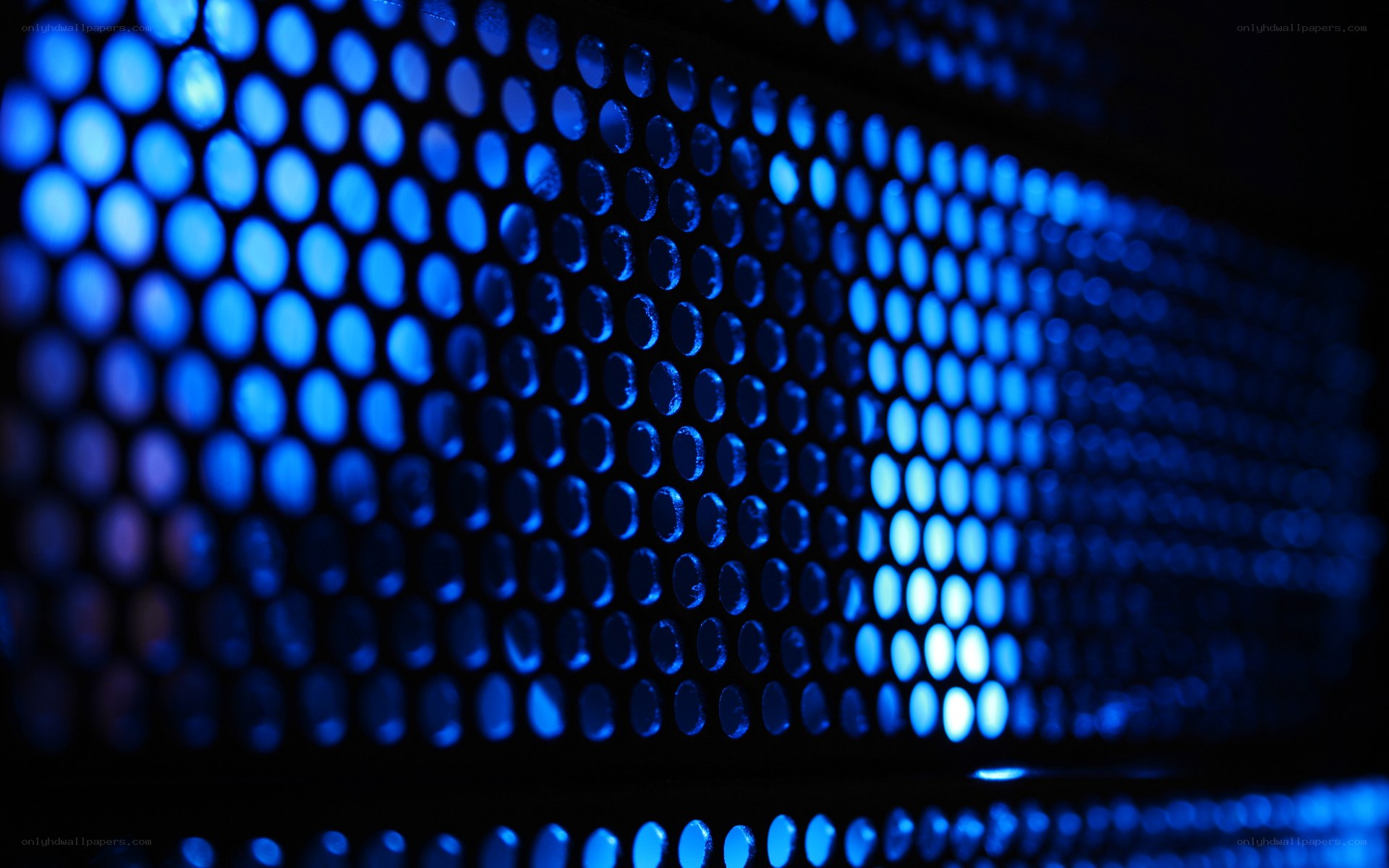 blue-lit perforated surface