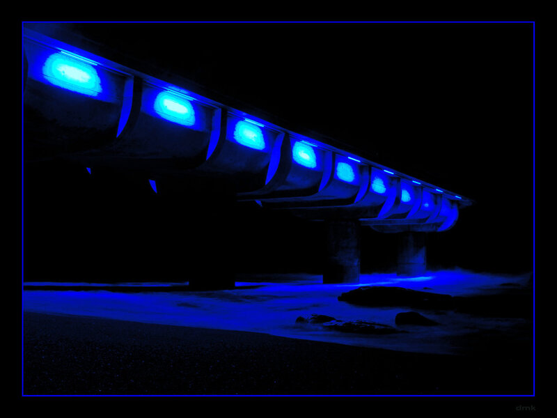 Blue-lit Pier at Night