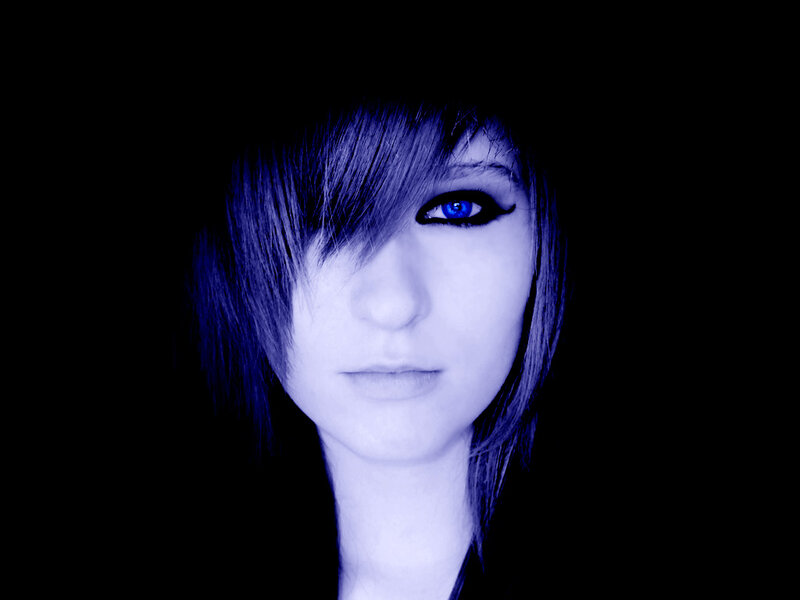 blue-lit portrait of a person