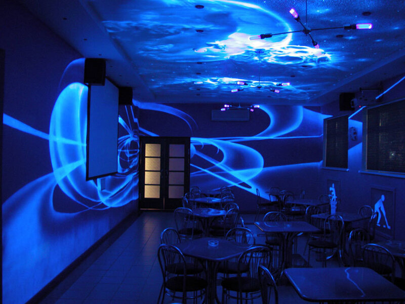 Blue-lit Room with Tables