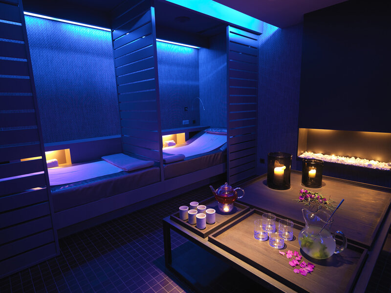 Blue-lit spa relaxation room
