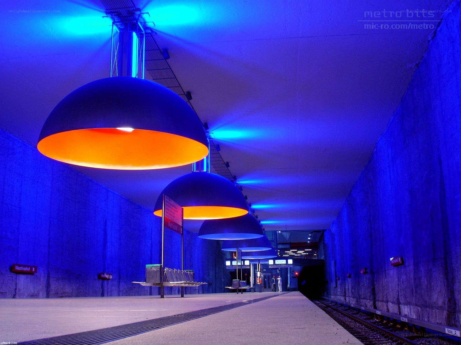 Blue-lit subway station