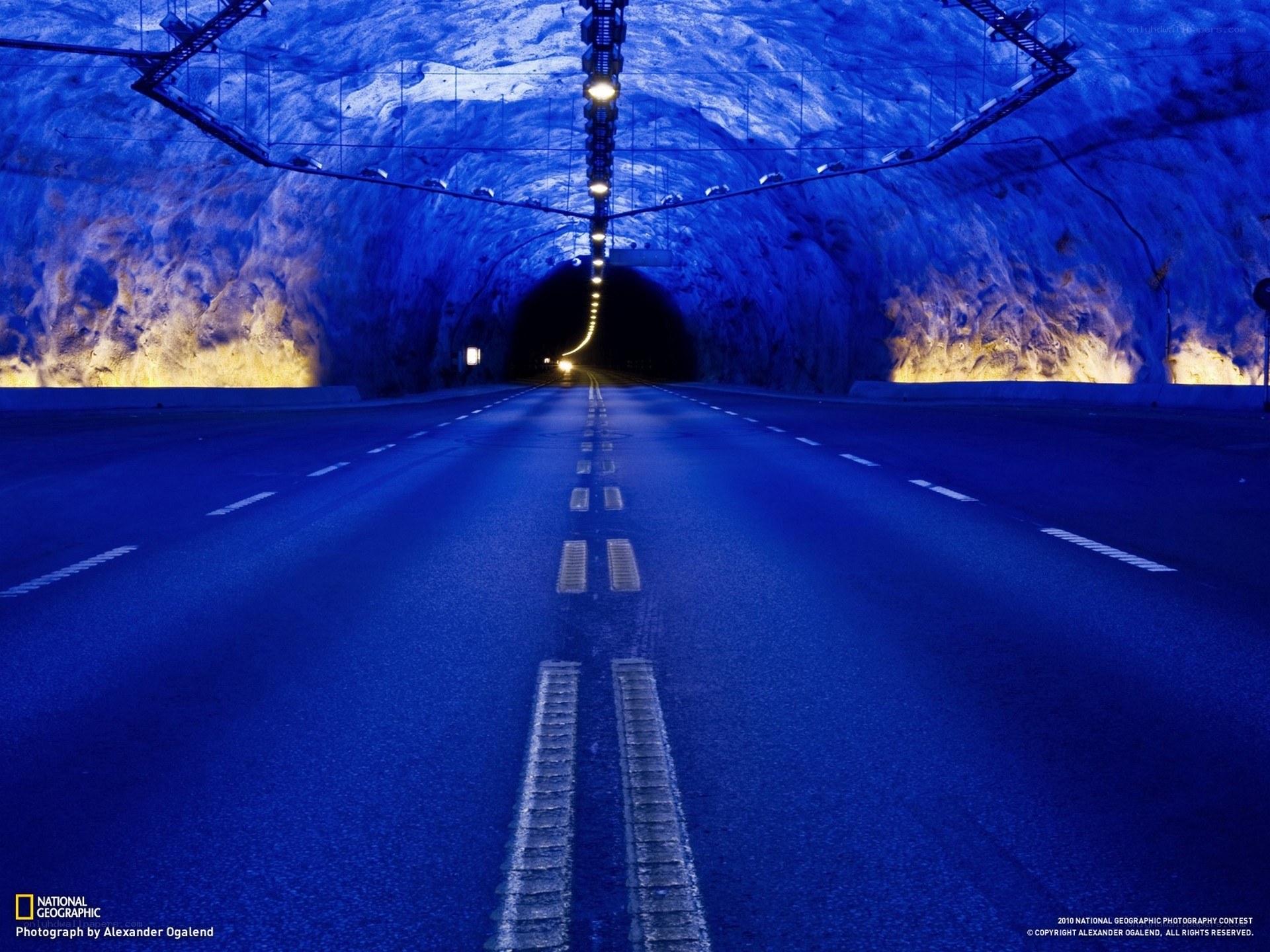 Blue-lit tunnel road