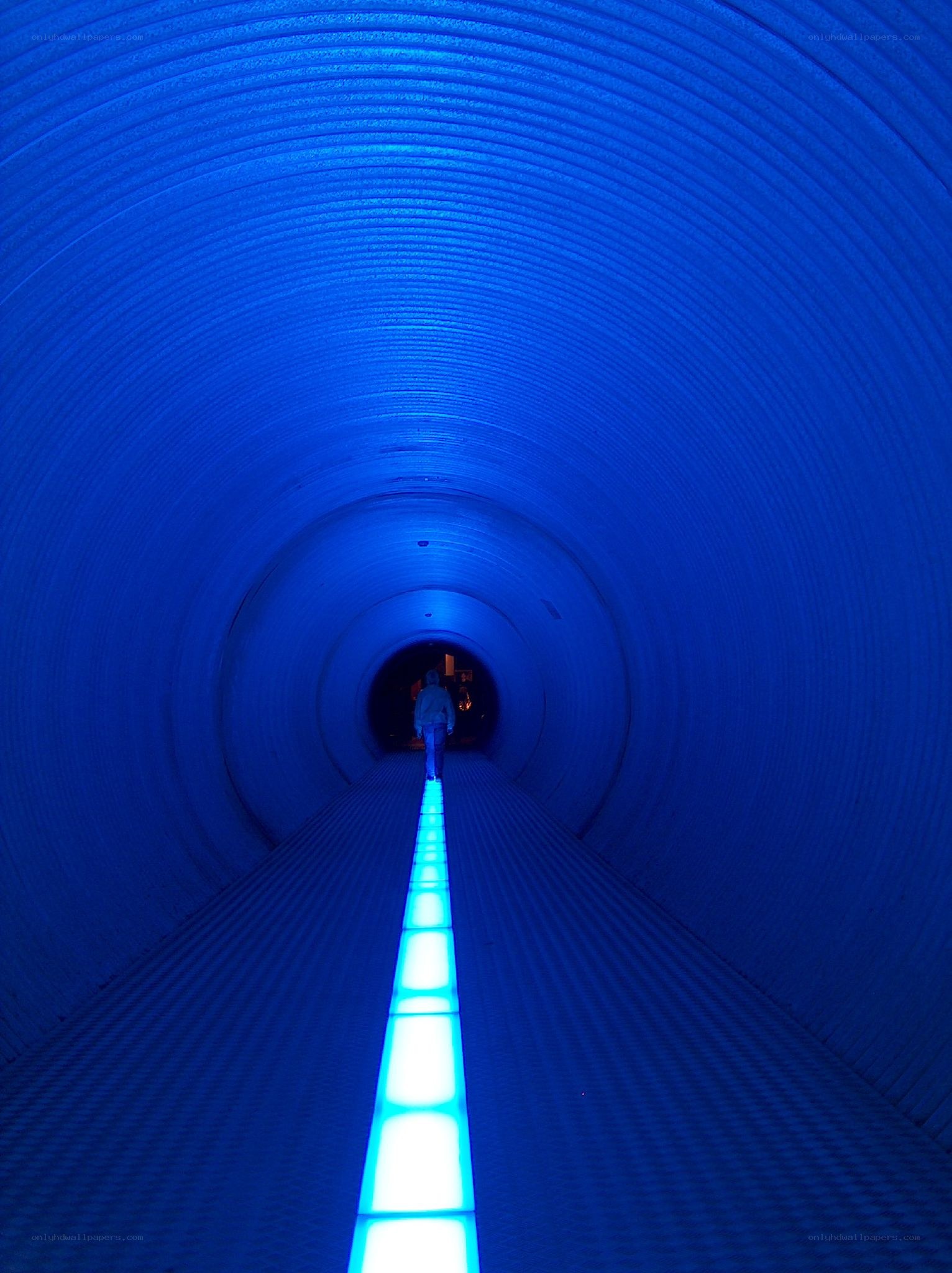 blue-lit tunnel walkway