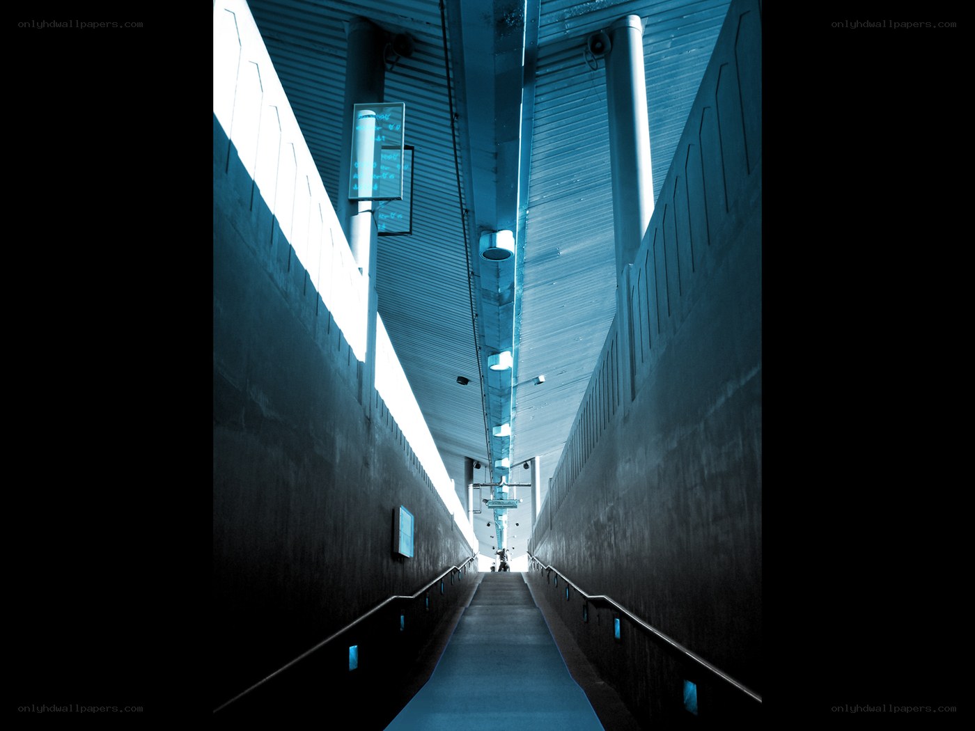 blue-lit underground walkway