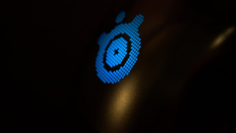Blue Logo on Dark Surface — Photograph