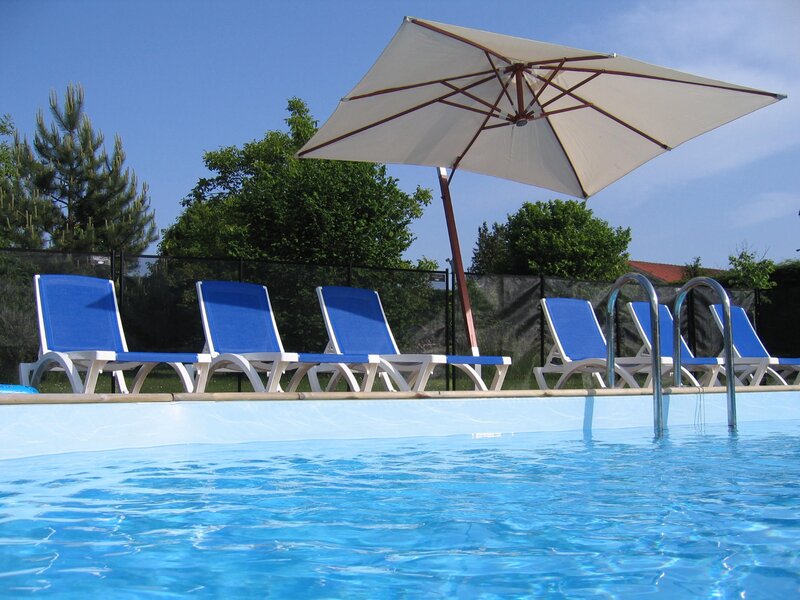 Blue lounge chairs by pool