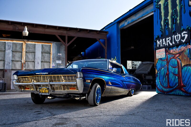 Blue lowrider car in garage