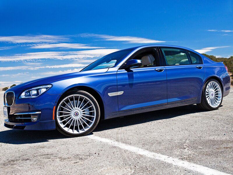 Blue luxury sedan on asphalt
