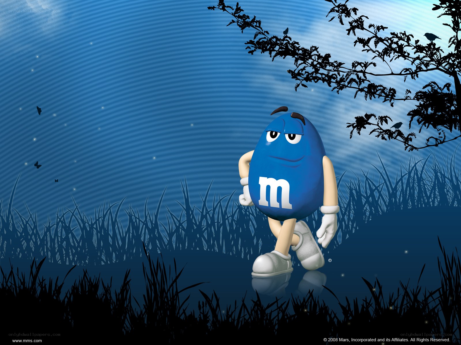 Blue M&M in a grassy field